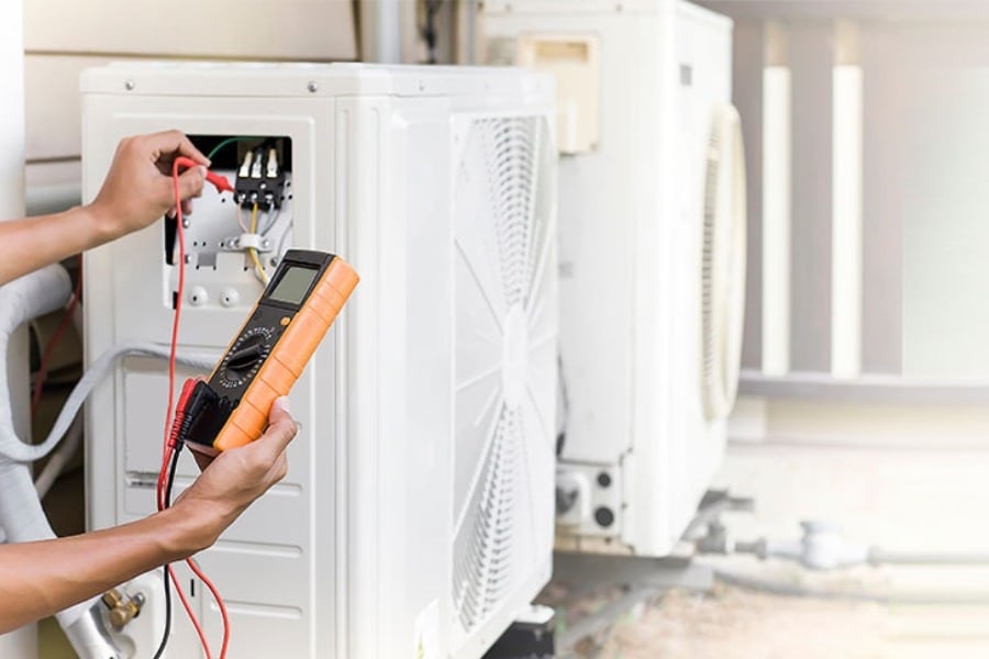 Technician servicing air conditioning in Canberra Air conditioning servicing Canberra